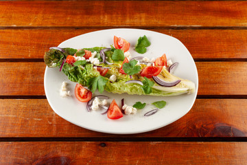 Summer vegetable salad with tomatoes and greens