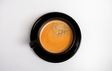 Isolated espresso coffee in modern black cup 