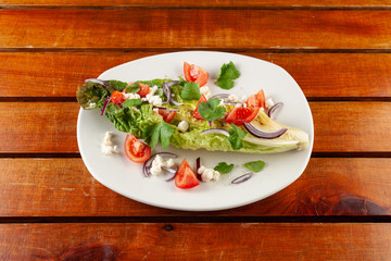 Summer vegetable salad with tomatoes and greens