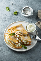 Crepes stuffed with cottage cheese cream