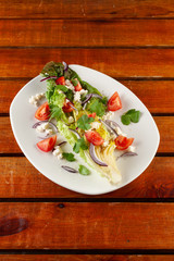 Summer vegetable salad with tomatoes and greens