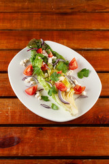 Summer vegetable salad with tomatoes and greens