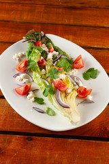 Summer vegetable salad with tomatoes and greens