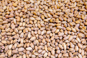 Pistachio on wooden table. Healthy food and snack.