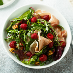 Prosciutto salad with walnuts and fresh raspberries