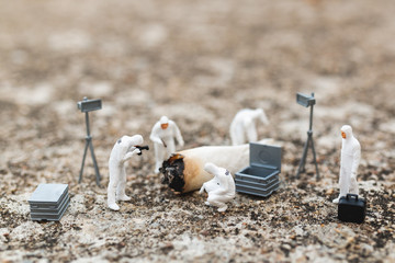 Miniature people : Police And Detective finding proof from old cigarette in crime scene