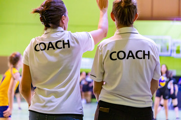 Fototapeta premium Female coaches in white COACH shirt