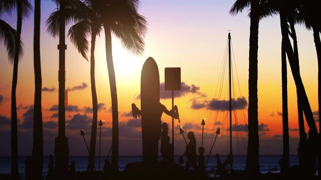 Tourists walking at sunset in Waikiki beach in 4k slow motion 60fps