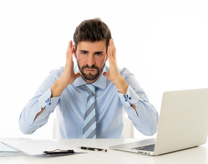 Portrait of frustrated businessman in pain with headache suffering from stress