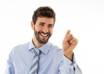 Portrait of a young handsome and confident businessman pointing as touching virtual screen
