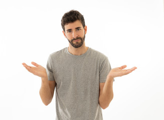 Good looking man with no idea, oops sorry or I do not care gesture smiling at the camera