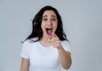 Young excited woman shocked and happy looking at unbelievable sales or surprise with overjoy