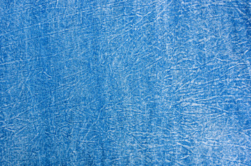 Blue washed faded jeans texture with seams
