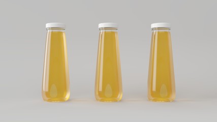 Three glass bottles with orange juice to design label.