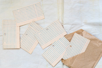 Old blank card files, lined and laid out. Paper for writing on envelopes from craft paper. Concept school, planning.