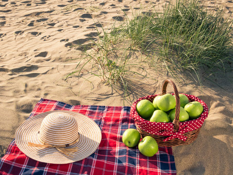 a picnic with picnic basket at the beach on holiday