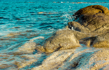vivid colorful rocky waterfront local scenery landscape with unfocused water splash 