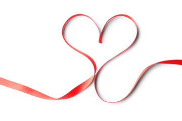 Heart made of red ribbon on white background, top view. Festive decoration