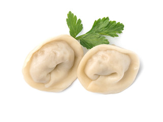 Fresh boiled dumplings and parsley leaf on white background, top view