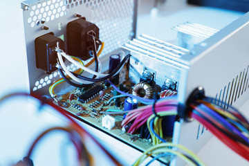 Power supply unit on table, closeup. Computer repair service