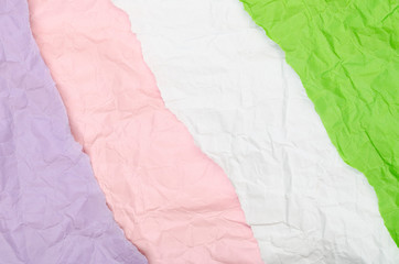 Background of a piece of crumpled paper of different colors