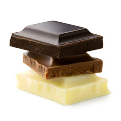 Stack of chocolate squares: dark, milk and white chocolate isolated on white. Rough edges.