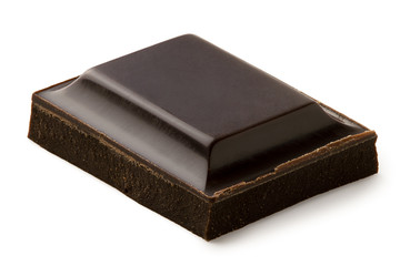 Single square of dark chocolate isolated on white.