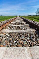 railroad track in open landscape 