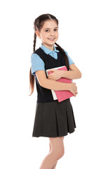 Portrait of cute girl in school uniform with books on white background