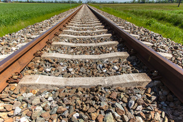 rail road track in open landscape 