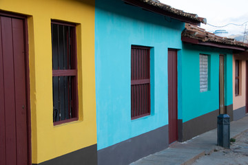 Fototapeta na wymiar Street view of colored houses in old town of Trinidad, Cuba