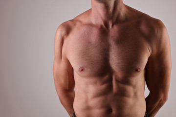 Fototapeta premium Man with scar on his shoulder close up. Laser Scar Reduction concept