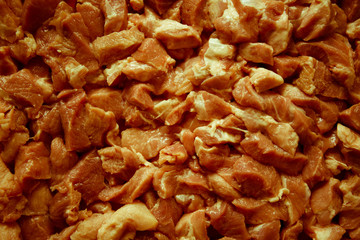 Heap of raw diced beef meat isolated, top view