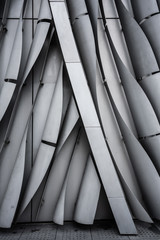 Fototapeta premium VerticalVertical bend gray aluminium modular facade with gap in repea bend gray aluminium modular facade with gap in repeat pattern / architectural texture / aluminium facade / background / abstract