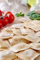 Healthy simple summer homemade food cooking raw vegetarian Italian pasta square ravioli with ingredients light flat lay