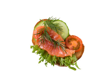 Sandwich with salmon and vegetables isolated on a white background.