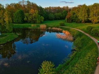 Fototapeta na wymiar landscape with lake and trees in park in Minsk Region of Belarus