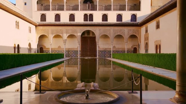The Nasrid Palaces Courtyard of the Myrtles in the Alhambra fortress in Granada, Spain