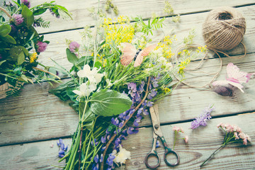 Fototapeta na wymiar Florist workspace with summer flowers