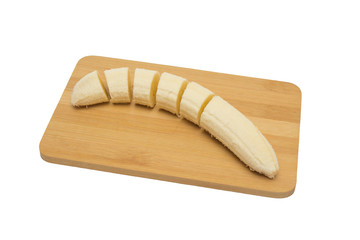 sliced banana on a cutting board, gradual serial cutting