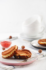 breakfast. Pancakes with peanut and strawberry jam. closeup.