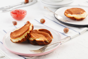 breakfast. Pancakes with peanut and strawberry jam. closeup.