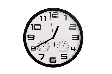 simple classic black and white round wall clock isolated on white. Clock with arabic numerals on wall shows 12:40 , 00:40