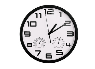 simple classic black and white round wall clock isolated on white. Clock with arabic numerals on wall shows 1:10 , 13:10