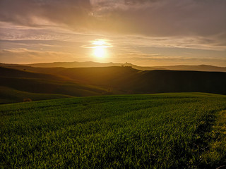 Fototapeta na wymiar Hilly landscape at sunset.