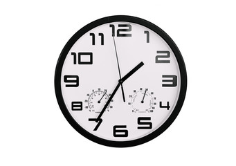 simple classic black and white round wall clock isolated on white. Clock with arabic numerals on wall shows 13:35 , 1:35