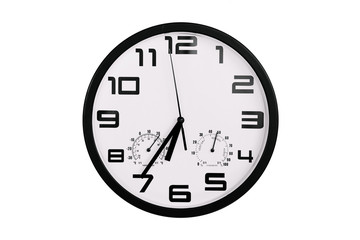 simple classic black and white round wall clock isolated on white. Clock with arabic numerals on wall shows 18:35 , 6:35