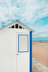 Beach cabins, blue sky and clouds on background