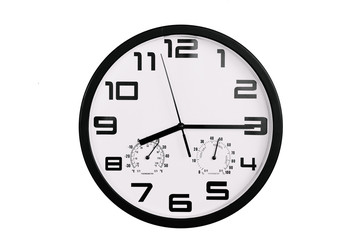 simple classic black and white round wall clock isolated on white. Clock with arabic numerals on wall shows 20:15 , 8:15