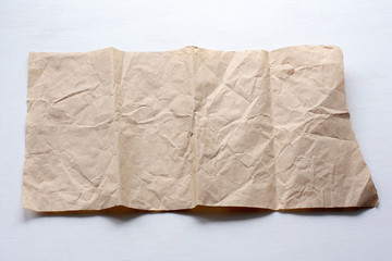 A piece of crumpled paper on a light background.
